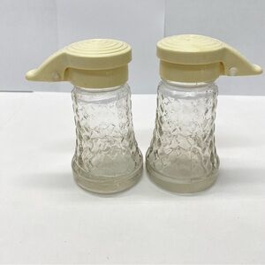 Vintage Daniells Salt and Pepper Shakers Set Beige Top Glass Bottom Plastic Tops